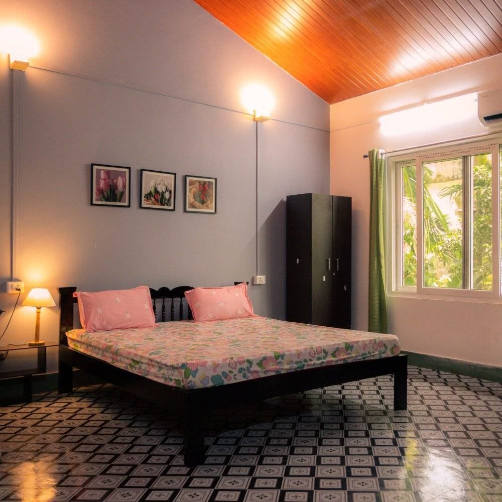 Bedroom with one double , AC, lights, switchboard, windows, curtains , lamp, mirror, table and switch board