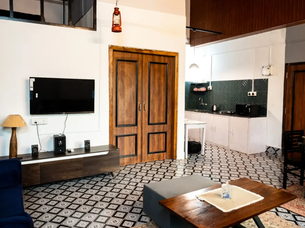 Lounge with open kitchen and dining table setup